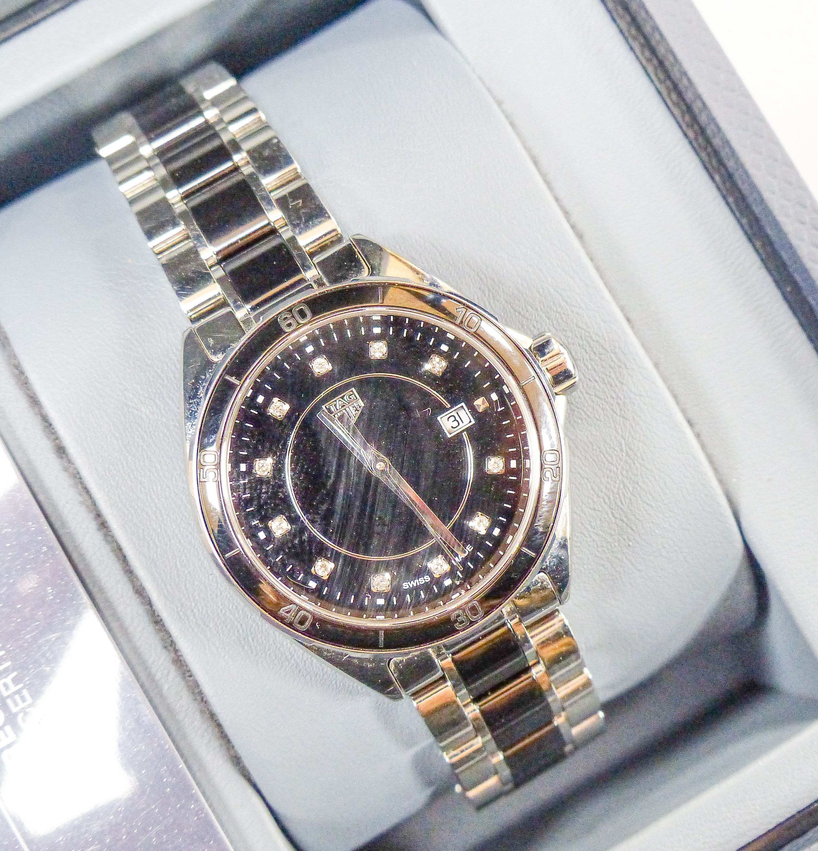 A modern stainless steel Tag Heuer quartz wrist watch with diamond dot numerals, case diameter 32mm, with box.